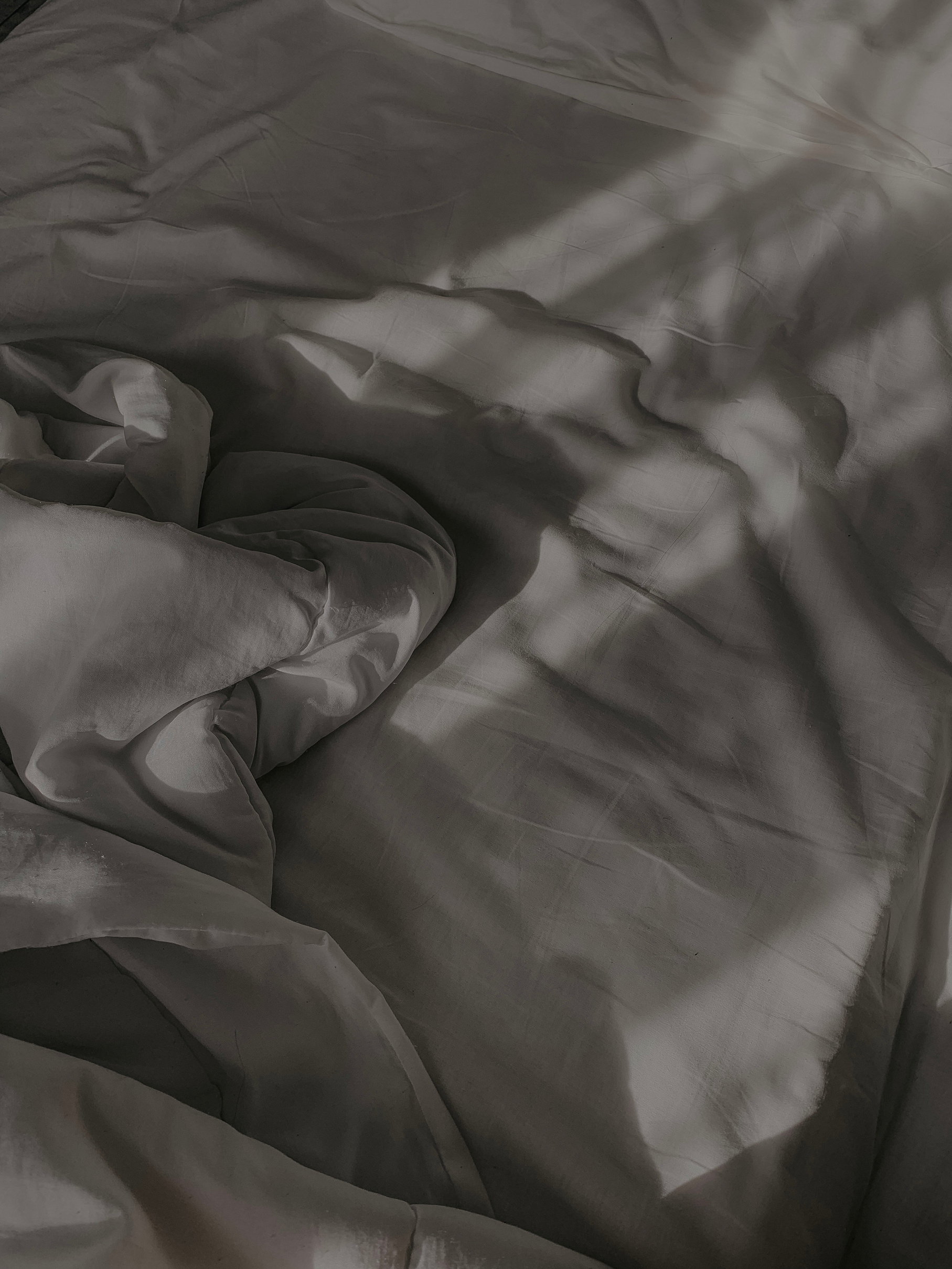 Grayscale Photo of a White Fabric